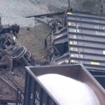 Two dozen train cars rolled over following derailment
