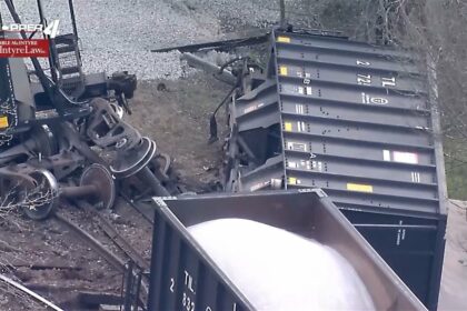 Two dozen train cars rolled over following derailment